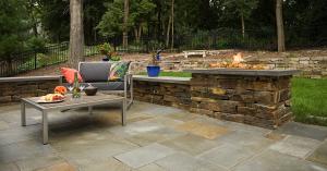 fire feature in a stacked stone wall