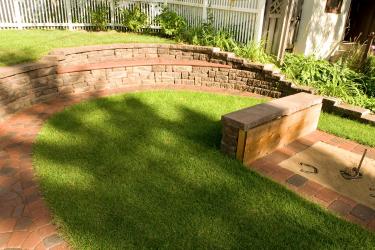 Modular block retaining wall with built-in seat bench.