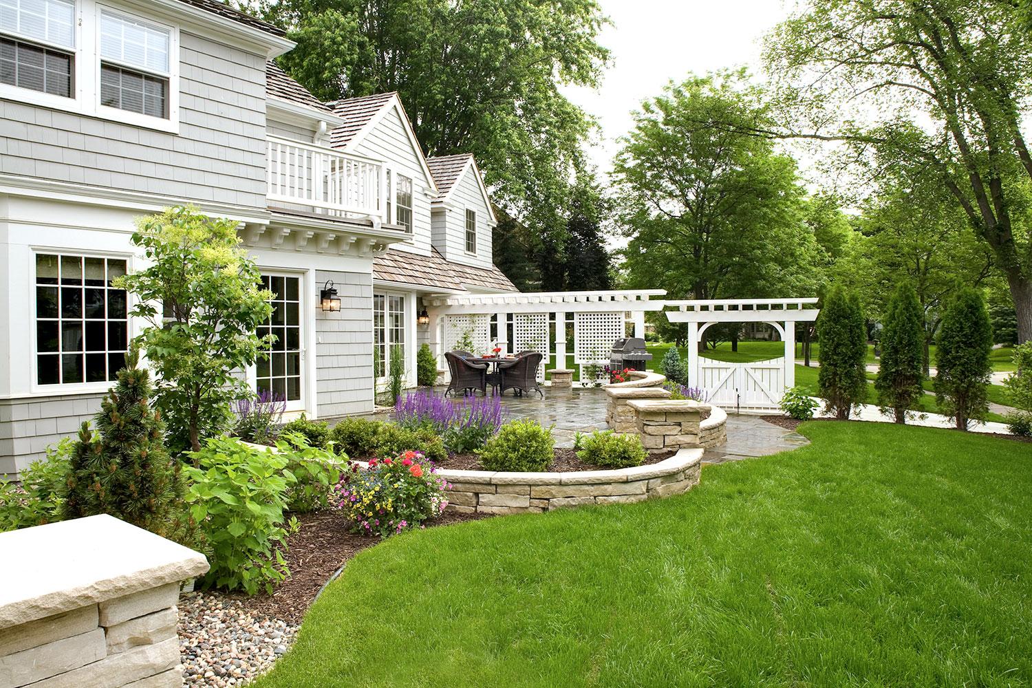 Edina MN Sideyard Landscaping with Patio, Chilton Wall, White Arbor and Gate