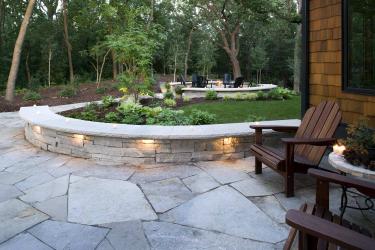 Natural stone path and stacked stone retaining wall