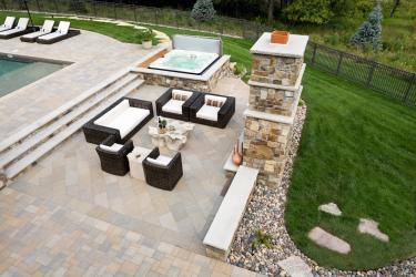 bird's-eye view of backyard with swimming pool, hot tub and patio