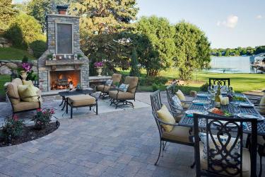Multipurpose fireplace and dining room backyard paver patio design and installation