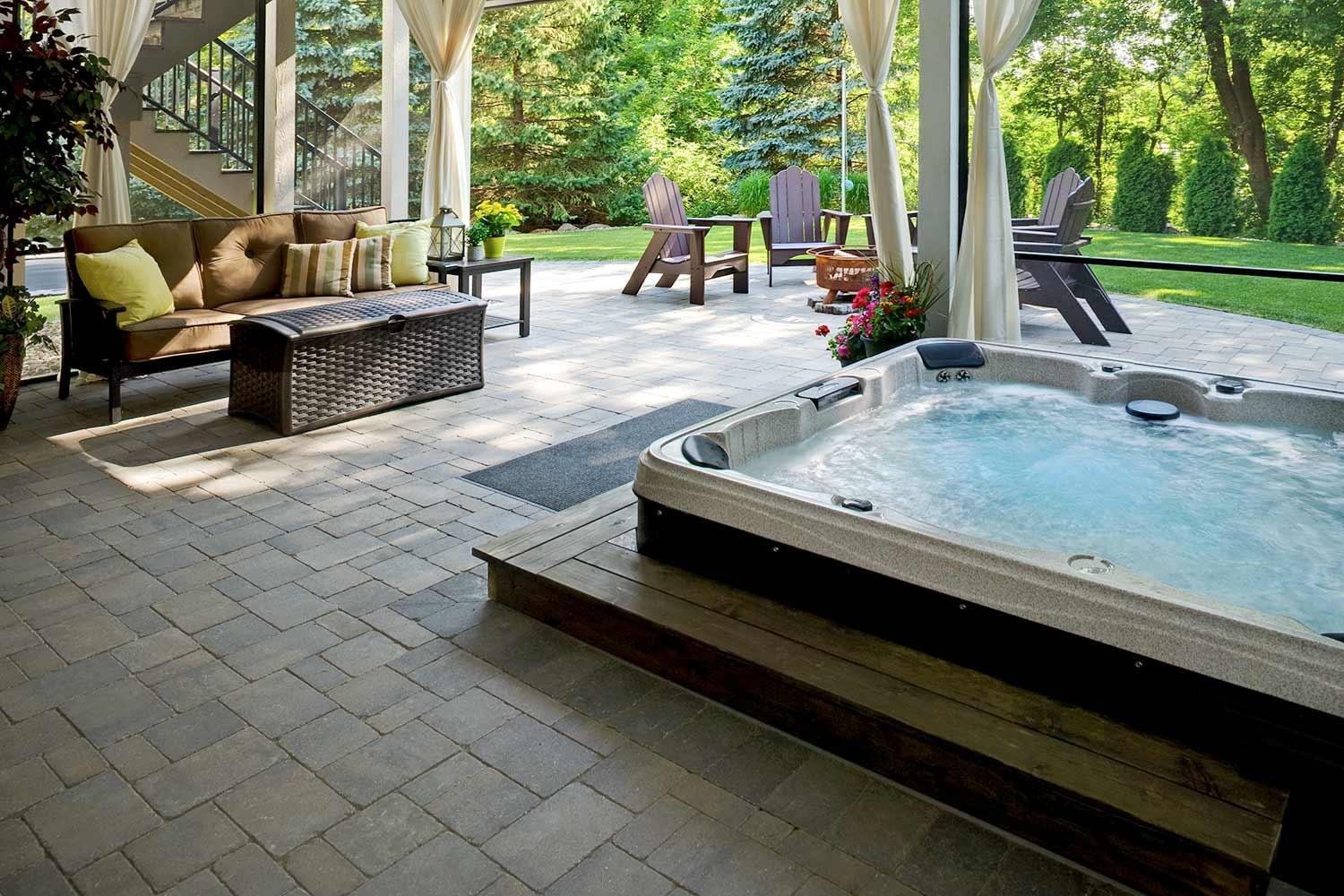 sunked hot tub and outdoor living room with bug screens and curtains