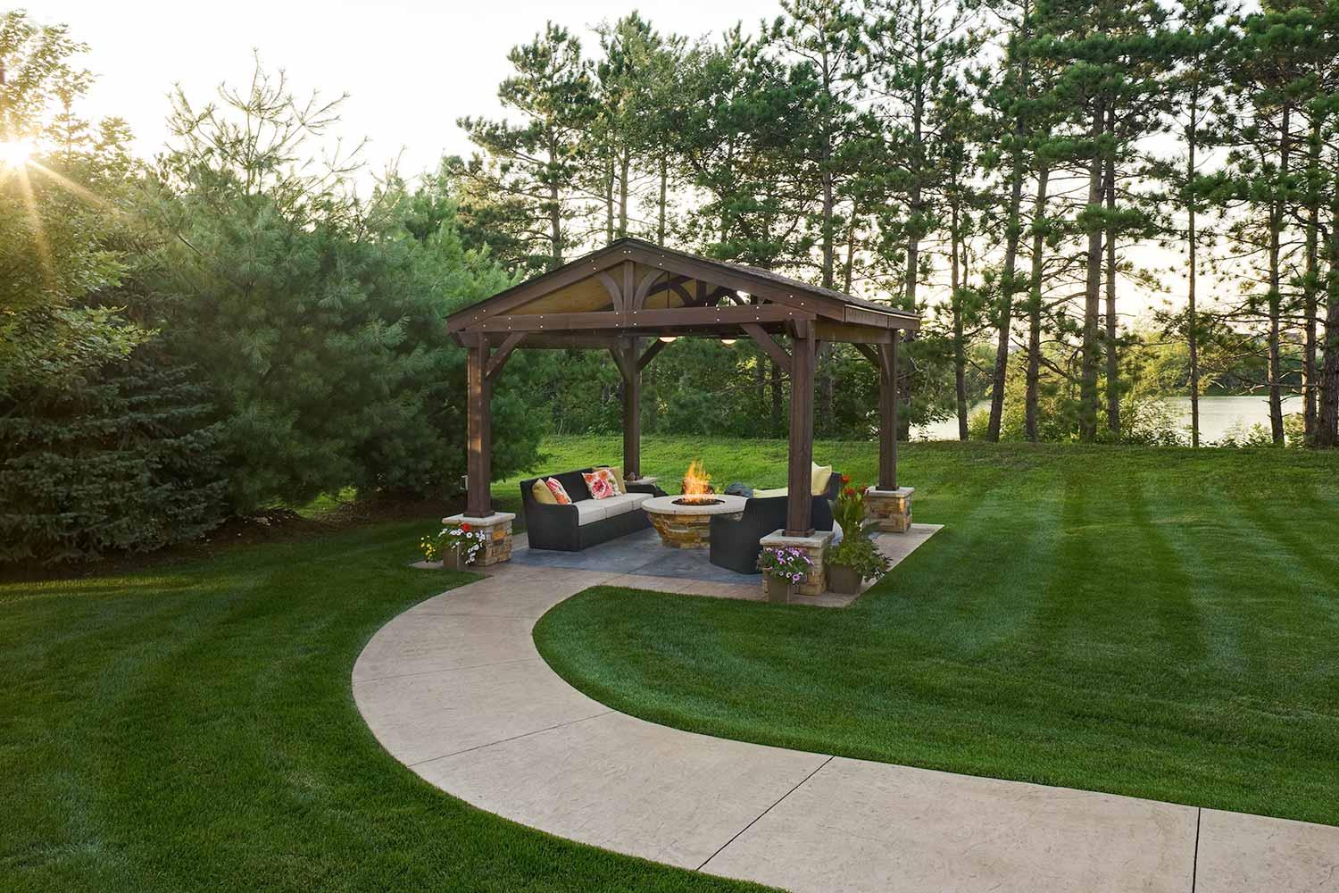 Lakeside outdoor living room with custom fire table