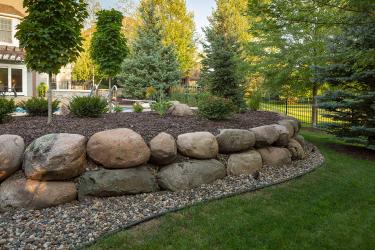 boulder retaining wall and garden
