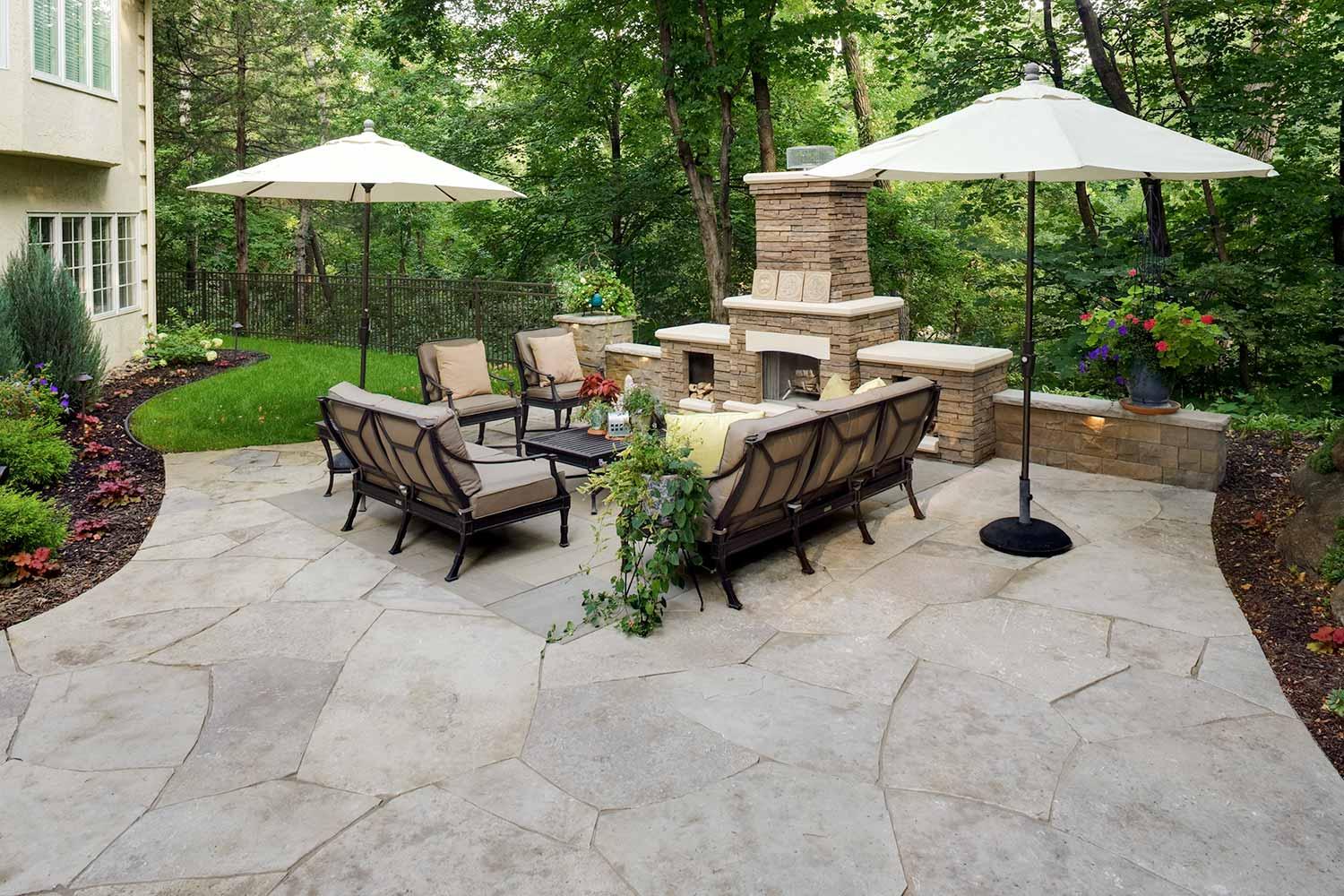 outdoor living room in Orono, MN with limestone flagstone patio and Laurel Stone inlay