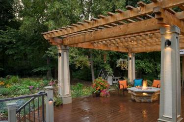 Deck with Pergola and Firetable in Award-Winning Landscape