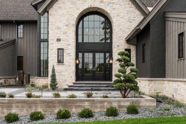 modern front entry design mixes rustic and modern elements