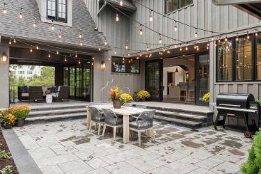sunken stone paver courtyard with contrasting border