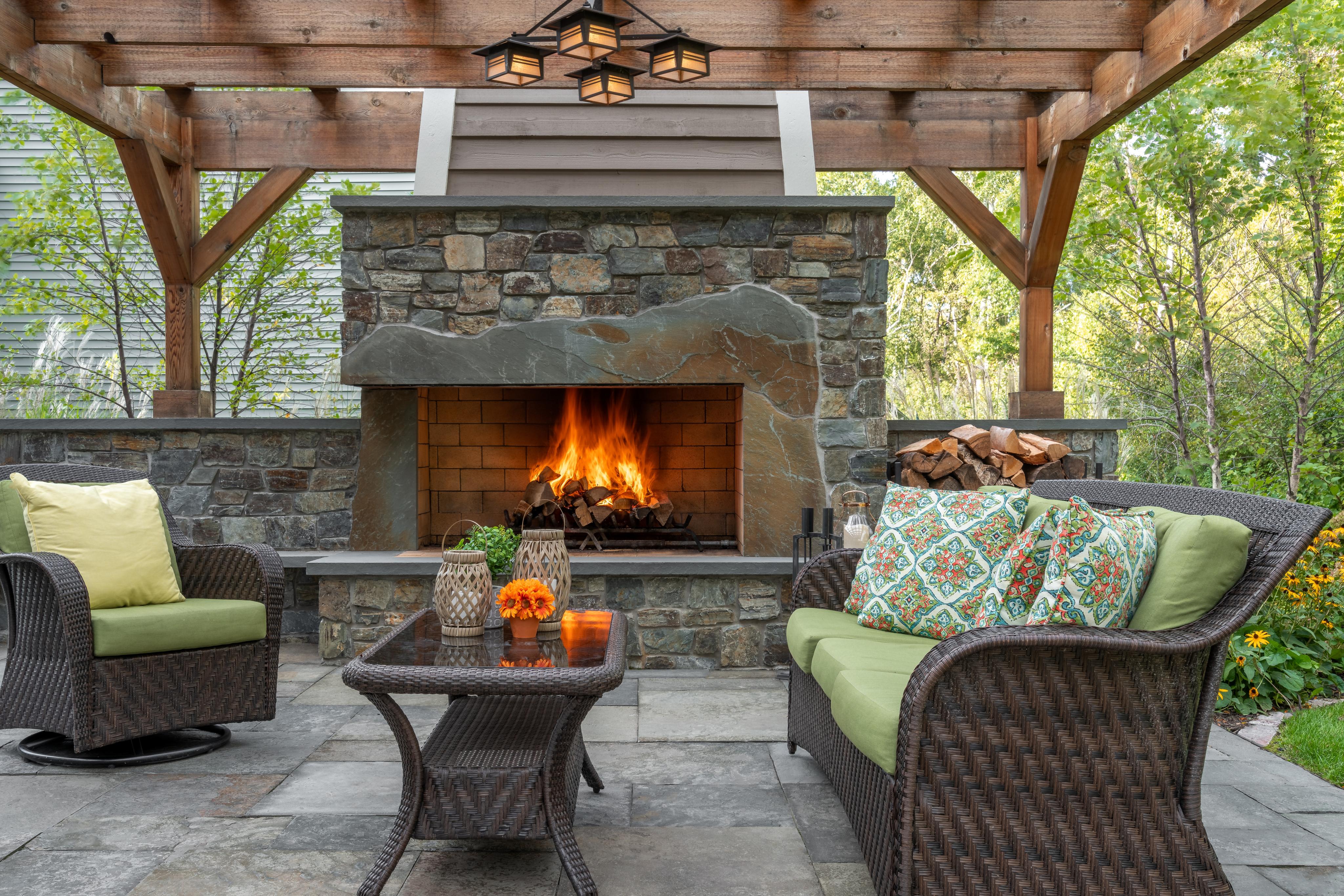 Pergola with stone fire place and patio