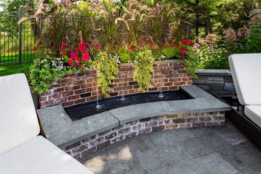 brick water feature with planters