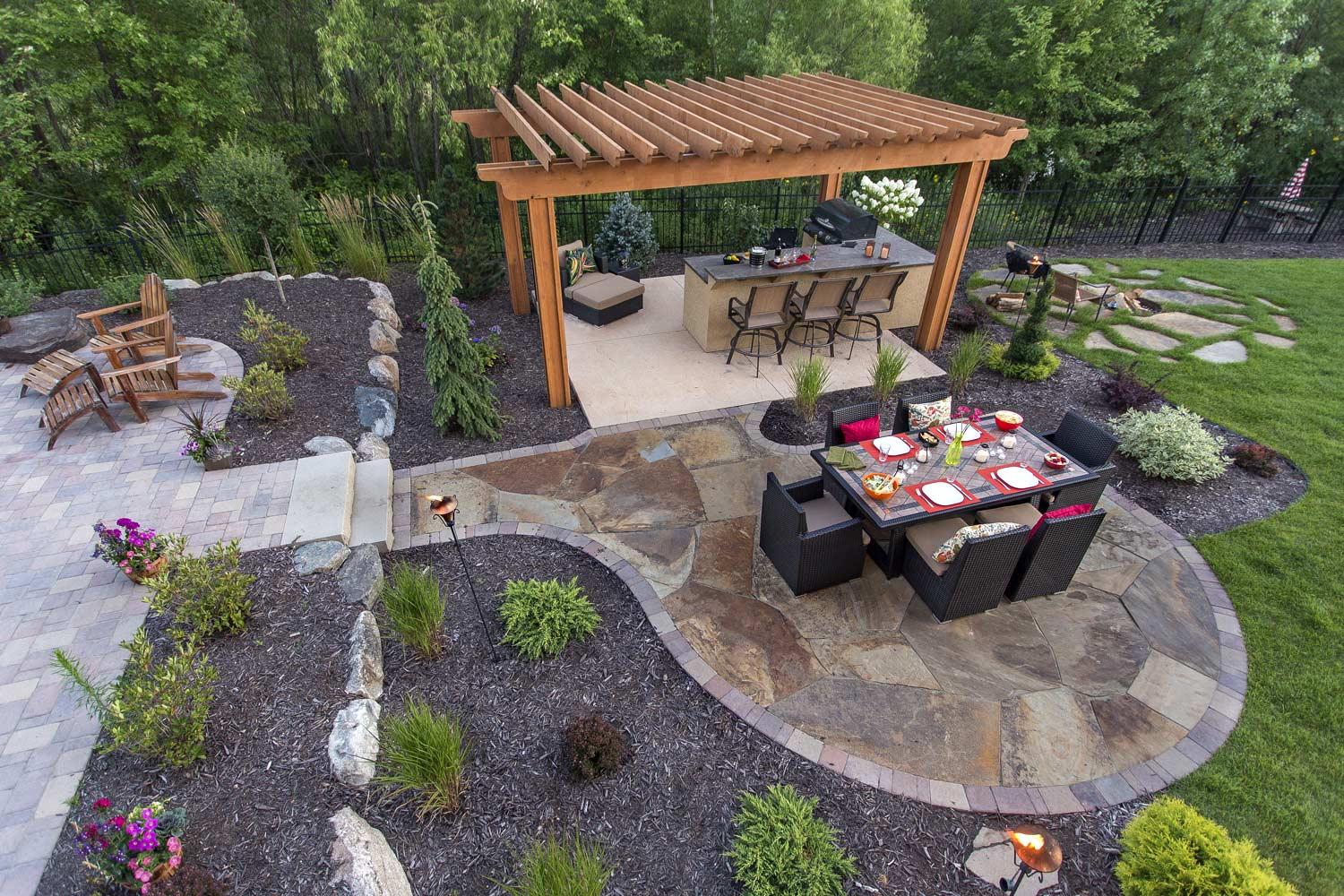 multiple patios and hardscape and structures create outdoor living rooms minneapolis,mn