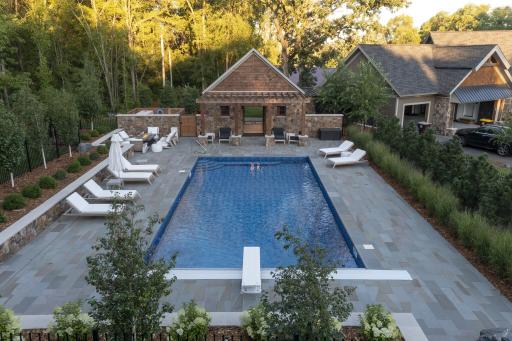 bluestone swimming pool deck with custom pool house 