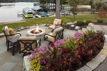 Colorful flower plantings on the fire patio