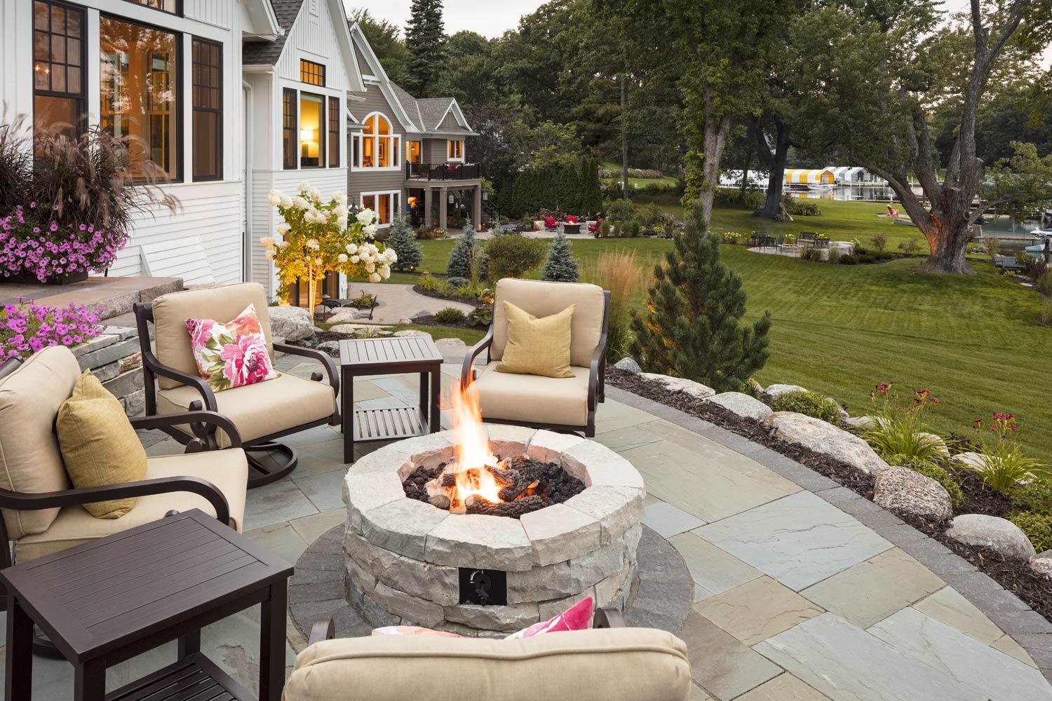 Natural stone fire pit patio on a boulder terrace