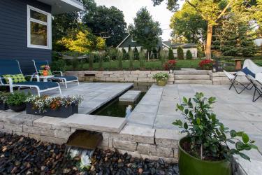 Contemporary landscape design with a moat water feature.
