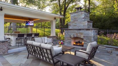 outdoor living room with fireplace and gazebo