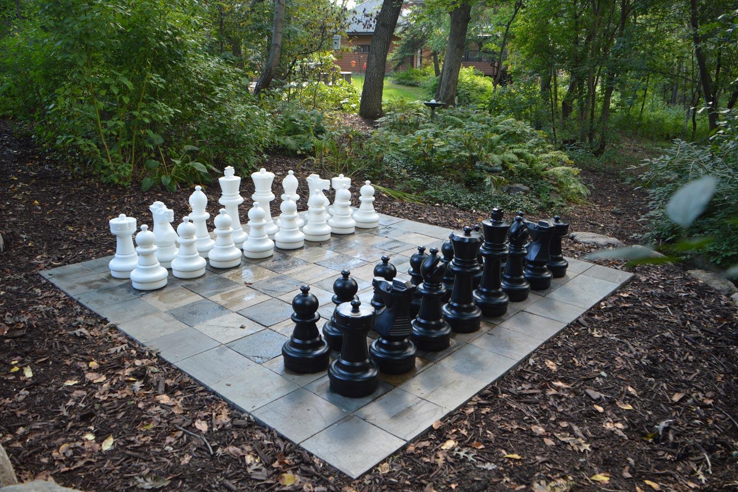 Magical life-sized chessboard in the woods.