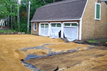 Excavated driveway creating a level base