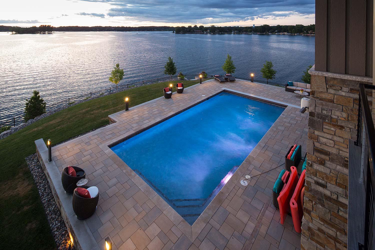 In ground patio swimming pool in prior lake with outdoor lighting perimeter
