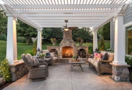 backyard patio with pergola and fireplace