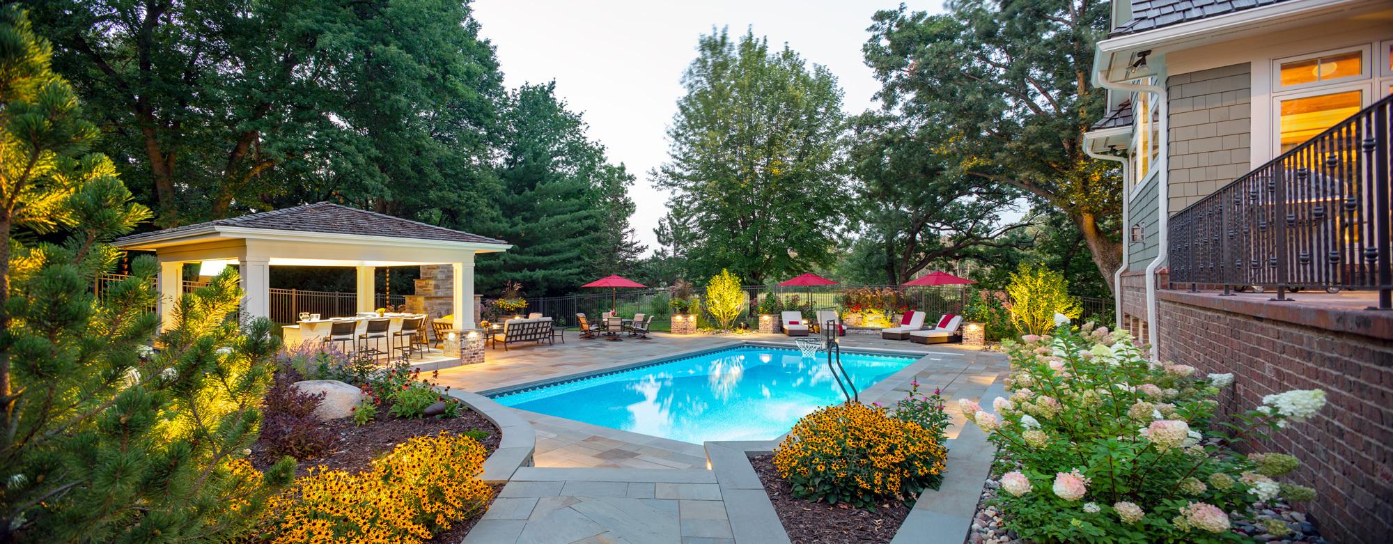 swimming pool landscape with perennial gardens in North Oaks MN