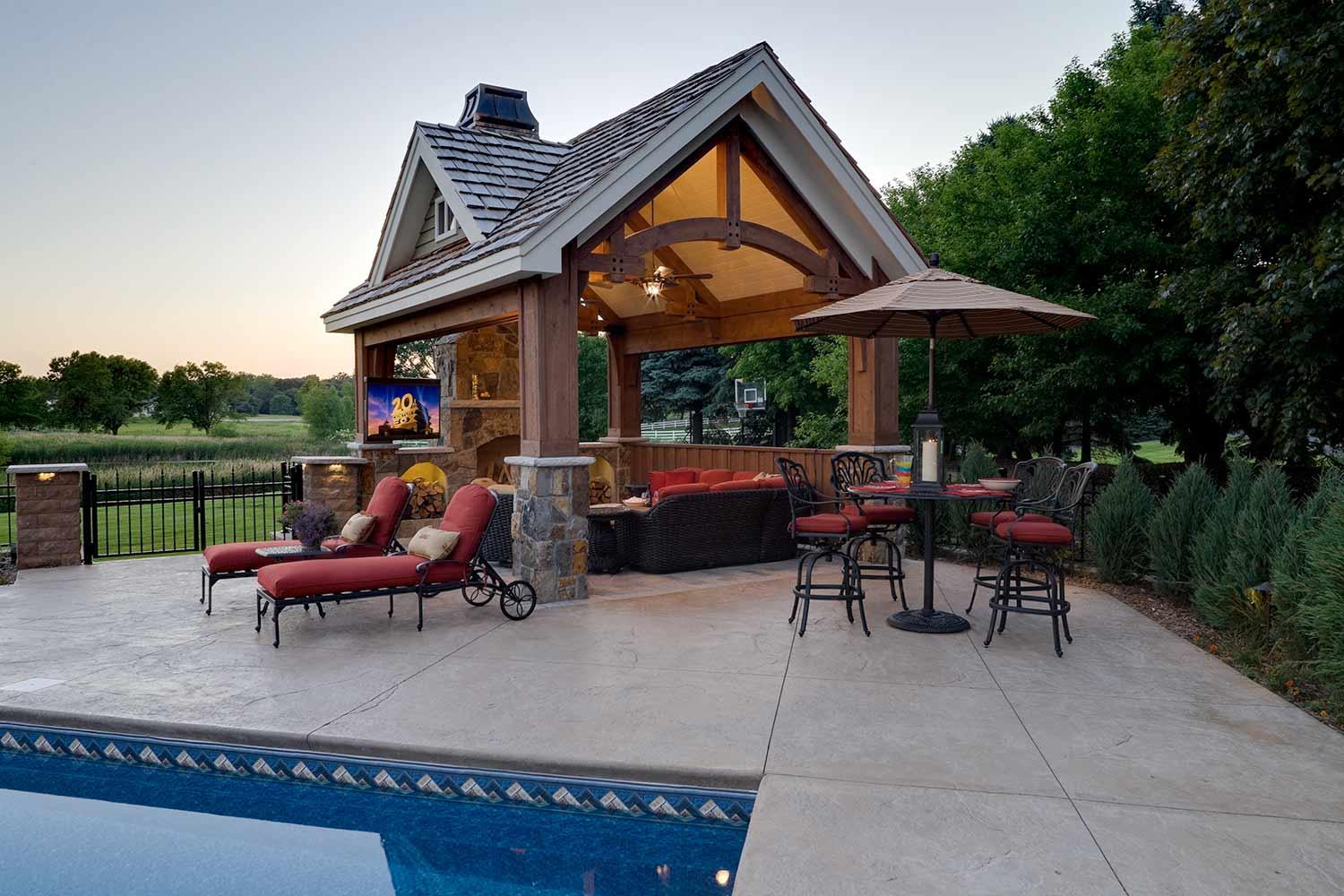 timber frame pool house structure with outdoor living room