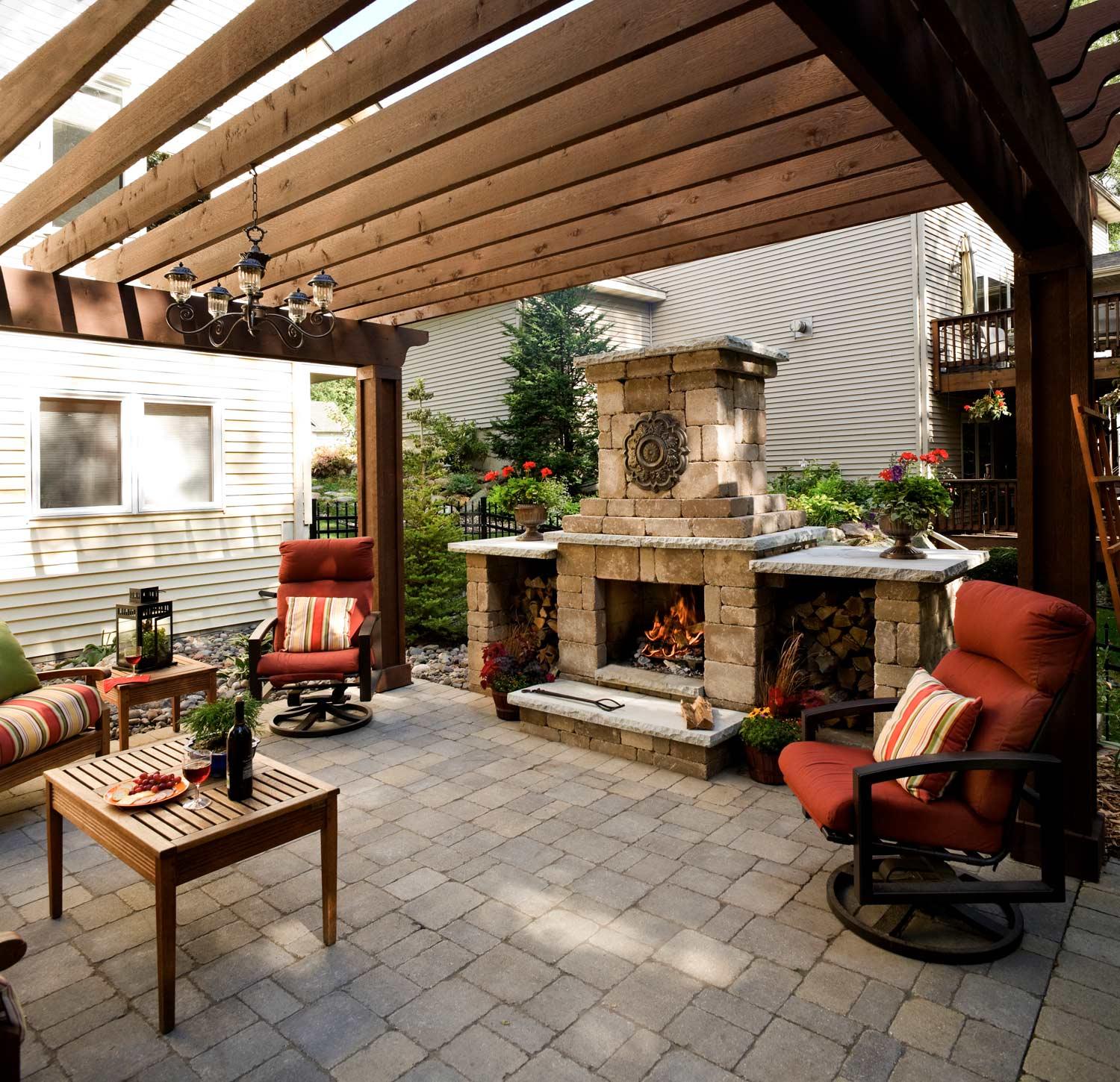 Pergola covers the entire patio in this small backyard landscape in savage