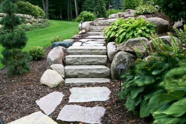 Natural stone steps with flagstone walkway.