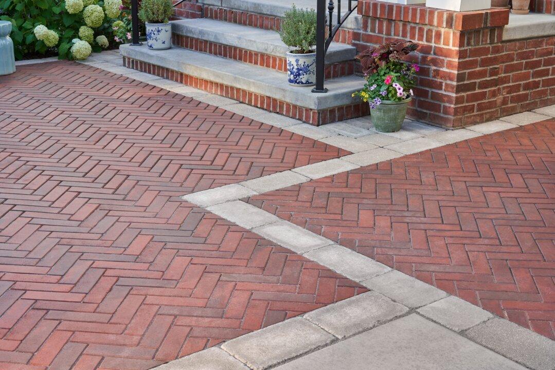 red clay brick pavers in a herringbone patio