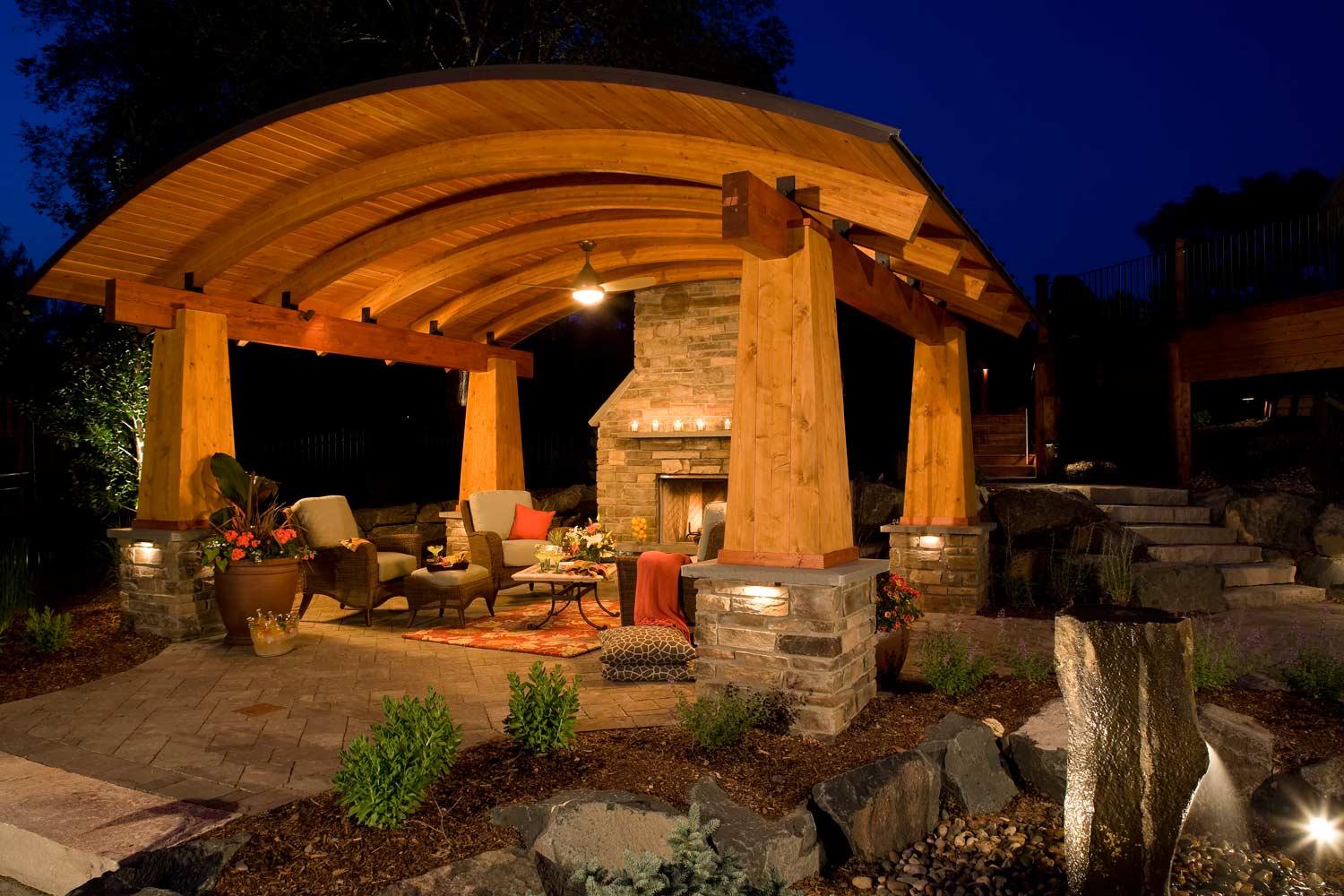 Outdoor living room with elegant and arching architectural structure design in Woodbury, MN