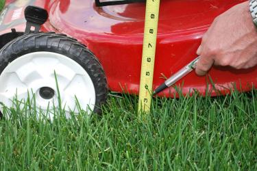 Lawnmower and measuring tape
