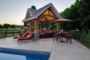 Timber frame pool house at sunset