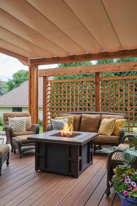 deck with outdoor furniture, gas fire table