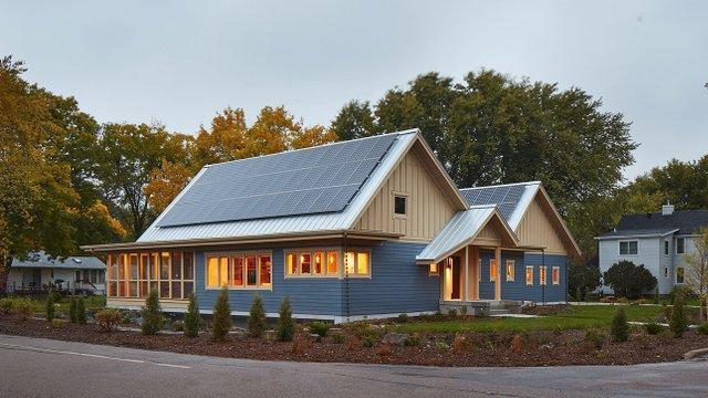 Net-zero new construction with solar panels and sustainable landscape design