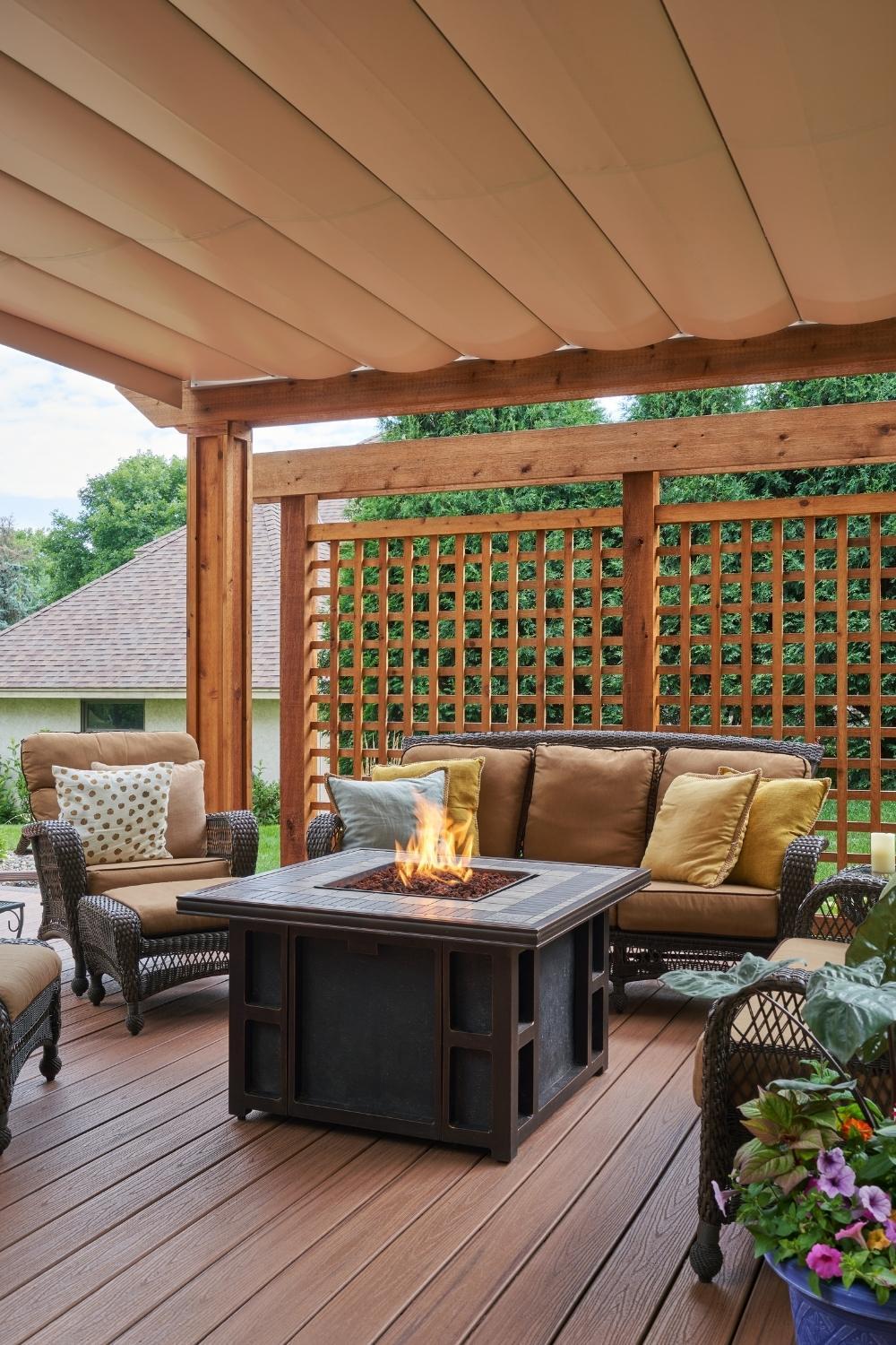 deck with living furniture, gas fire table, pergola shade is closed