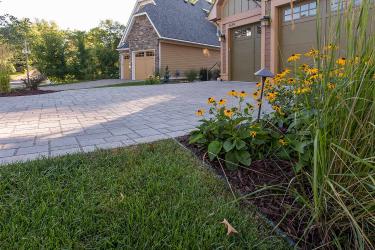 permeable lake house drive way and sustainable garden plants