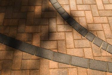 Beautifully inset basketball court lines in the brick driveway