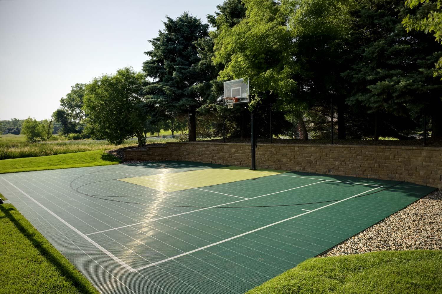 Hard plastic backyard basketball court