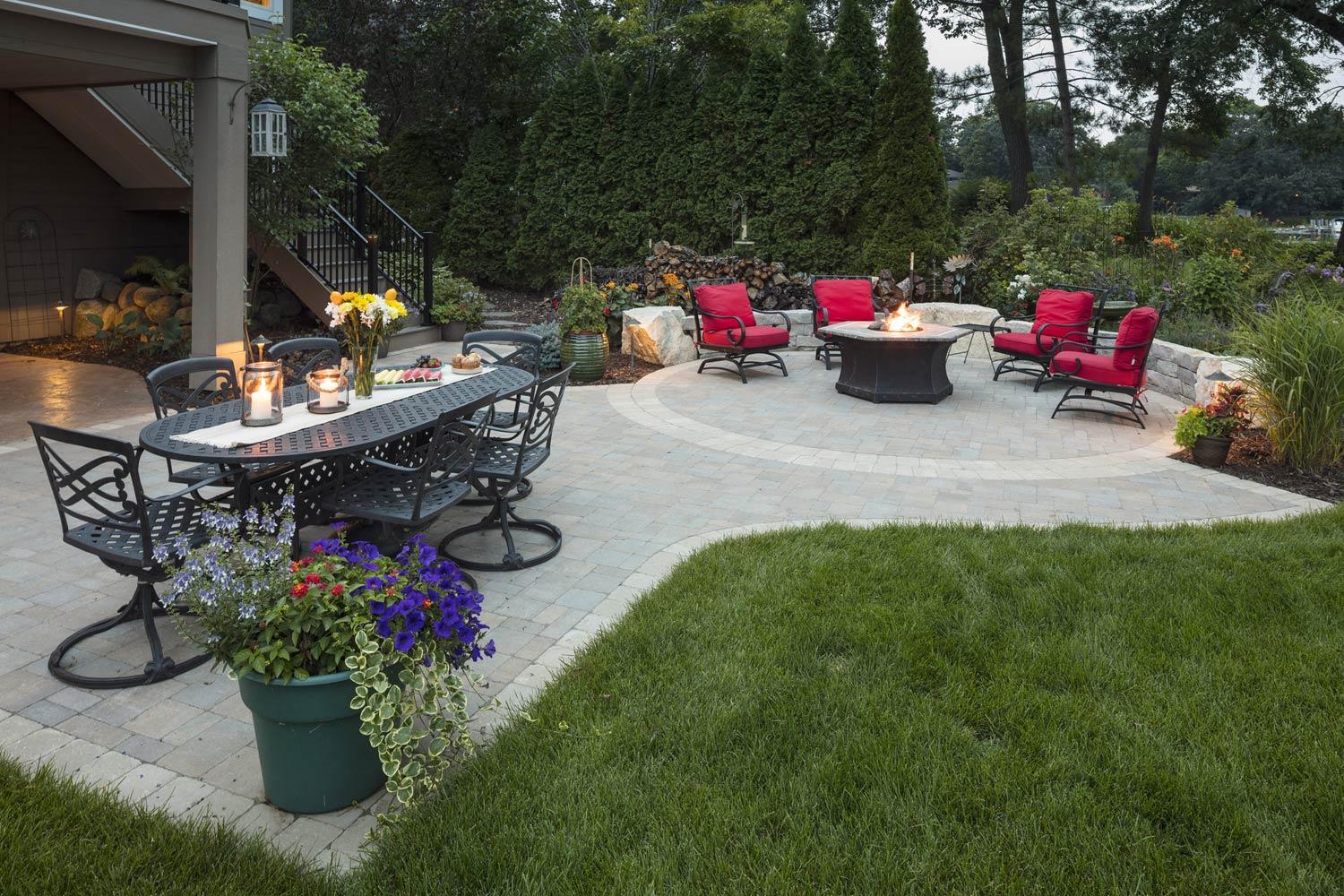 Flexible paver patio  with fire pit in a Minnetonka backyard